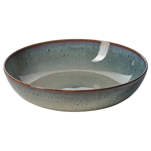 Eine GLADELIG Schale in grünlich-blau mit Vintage-inspirierter, handgefertigter Optik. Es besteht aus Feinsteinzeug mit einer reaktiven Glasur und eignet sich perfekt zum Servieren von Mahlzeiten.