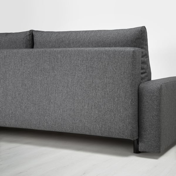 Ein graues Stoffschlafsofa mit Stauraum unter dem Sitz.