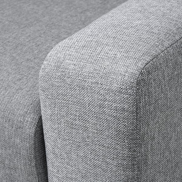 Nahaufnahme einer modernen Sofaecke mit weichem, weichem, grauem Stoff mit sauberen Nähten.