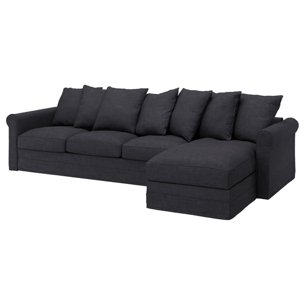 Dunkelgraues, tiefer Sitz, L-förmiges Sofa mit weichen Kissen.