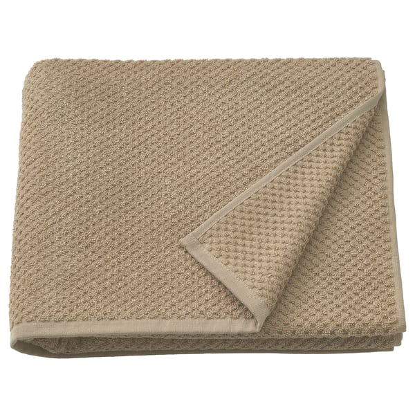 Gefaltetes beiges GULVIAL Handtuch, 100% Baumwolle, weich, mitteldick, unifarbenes Design.