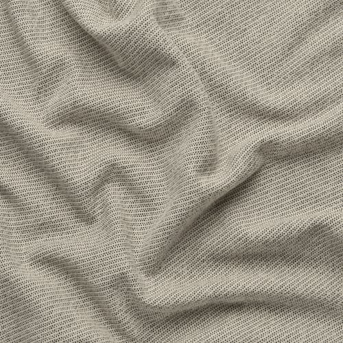 Nahaufnahme eines weichen, strukturierten Stoffes mit subtilen Mustern, wahrscheinlich ein Sofa- oder Vorhangstoff, der seine feine Textur und hochwertige Webart zur Geltung bringt.