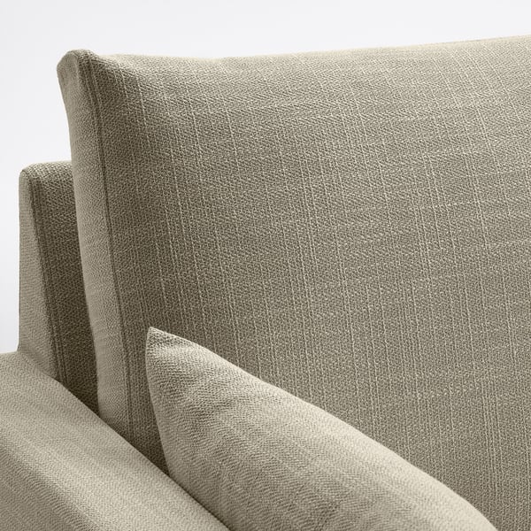 Nahaufnahme der Rückenlehne eines modernen Sofas, das mit strukturiertem Stoff bezogen ist und seine klaren Linien und seine hochwertige Verarbeitung zeigt.