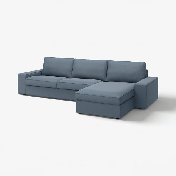 Ein blaues KIVIK-Ecksofa mit Chaiselongue, das saubere Linien und unterstützende Polster zeigt, perfekt zum Entspannungsaufbau.