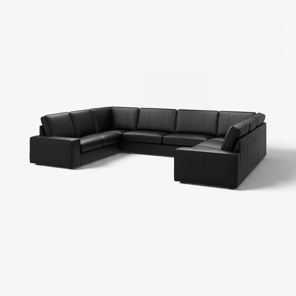 Großes schwarzes Ledersofa mit tiefem Sitz und niedrigen Armlehnen, ideal zum Entspannungsaufbau.