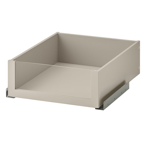 Eine cremefarbene KOMPLEMENT-Schublade mit Glasfront, die den Blick ins Innere freigibt. Die Schublade ist schlank, moderne Linien und ein Slow-Close-Mechanismus.