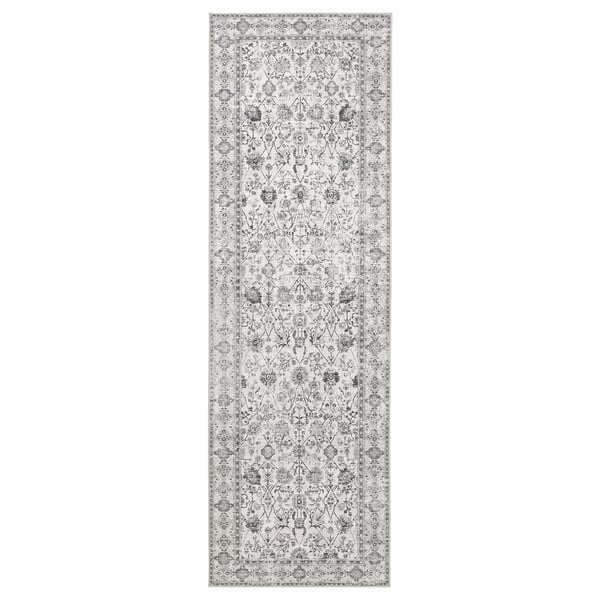 Langer, grauer, rechteckiger Läuferteppich mit filigranen Blumenmustern in Schwarz und Weiß, gefertigt aus recyceltem Polyester.