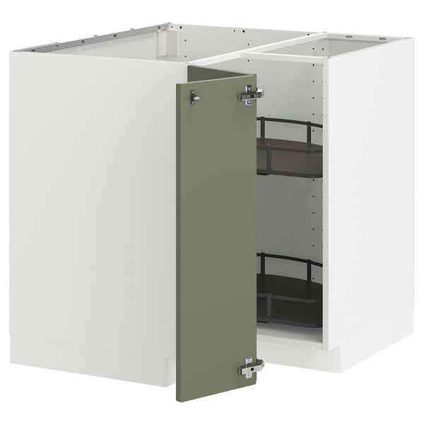 Ein weißer METOD-Küchenschrank mit einer grünen Tür, die sich öffnen lässt und verstellbare Regale freigibt.