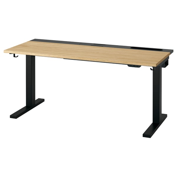 MITTZON Schreibtisch: Platte aus braunem Holz, schwarze Metallbeine, höhenverstellbar.