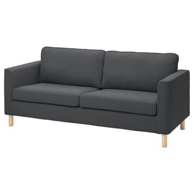 Ein PÄRUP-Sofa aus dunkelgrauem Cord mit hellen Holzbeinen in einem modernen und schlanken Design.