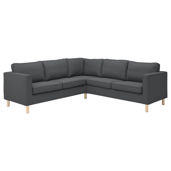 Ein dunkelgraues Ecksofa von PÄRUP mit breitem Cordbezug, hellen Holzbeinen und modernem, bequemem Design.