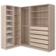 Ein heller holzfarbener PAX-Kleiderschrank mit mehreren Regalen und Schubladen zur Aufbewahrung.