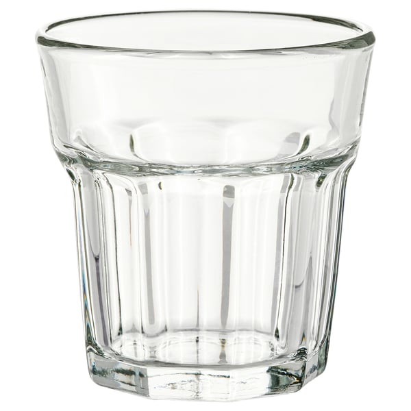 Ein Becher aus gehärtetem Glas der Marke POKAL. Es ist klar, zylindrisch mit geriffelten Seiten und für verschiedene Getränke konzipiert.