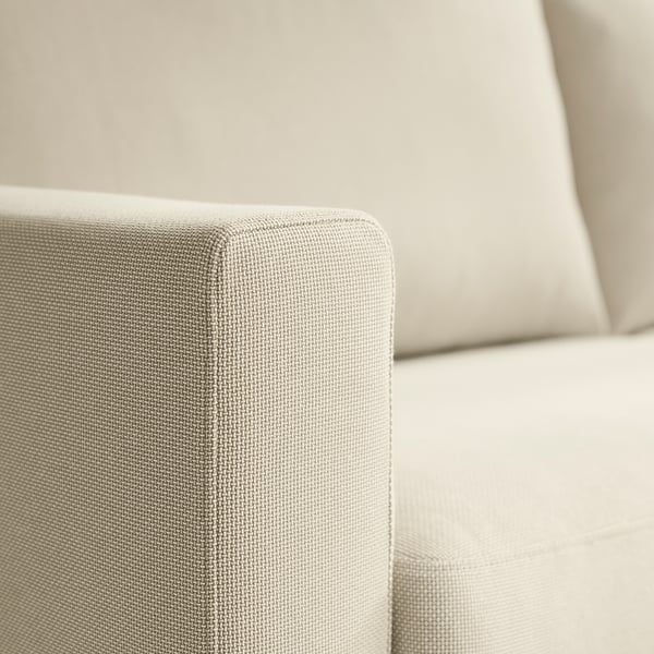Nahaufnahme einer modernen Sofalehne, die seine Textur und das Design zeigt. Sofa bequem, unterstützende Polster und ein sauberer, minimalistischer Stil.