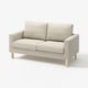 Ein beiges SALTSJÖBADEN 2-Sitzer-Sofa mit leichten Holzbeinen, ausgestattet mit Taschenfedern und abnehmbaren, waschbaren Bezügen.
