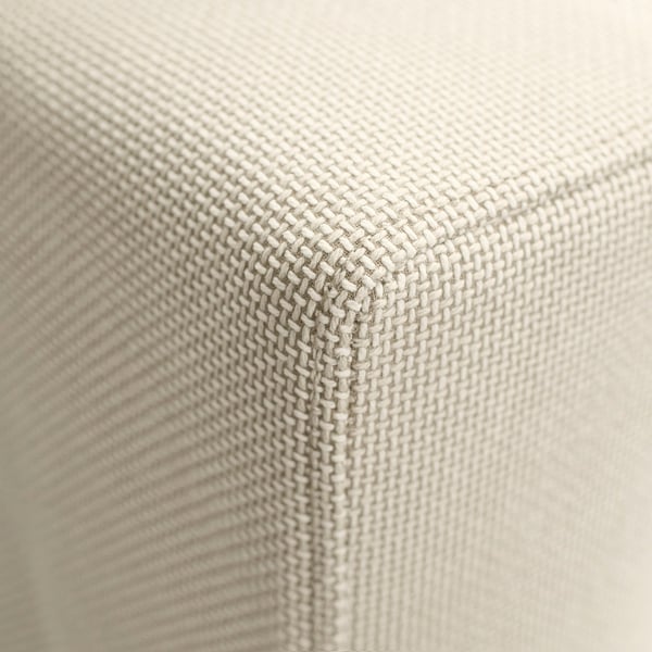 Nahaufnahme eines weichen, kunstvoll gewebten Stoffes, vermutlich von einem hochwertigen Sofa.