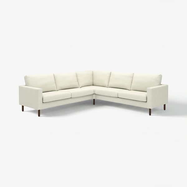 Ein SALTSJÖBADEN off-white Ecksofa mit minimalistischem Design, mit stützenden Taschenfedern und abnehmbaren, waschbaren Bezügen.