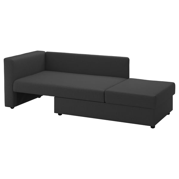 Das Bild zeigt ein modernes schwarzes SKÖNABÄCK Schlafsofa mit links umklappbarer Armlehne, das Sitz-, Schlaf- und Ablagefunktionen bietet.
