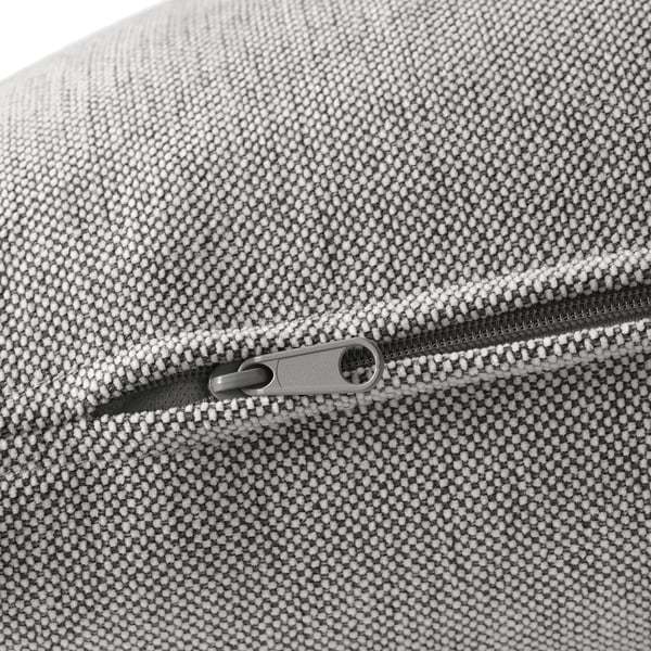 Nahaufnahme einer hochwertigen, strukturierten Polsterung mit elegantem Reißverschlussdetail, die langlebige Handwerkskunst zeigt.