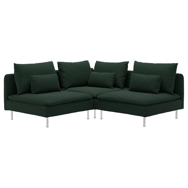 Dunkelgrünes, modernes Ecksofa mit zahlreichen Kissen, erhöht auf schlanken Chrombeinen.