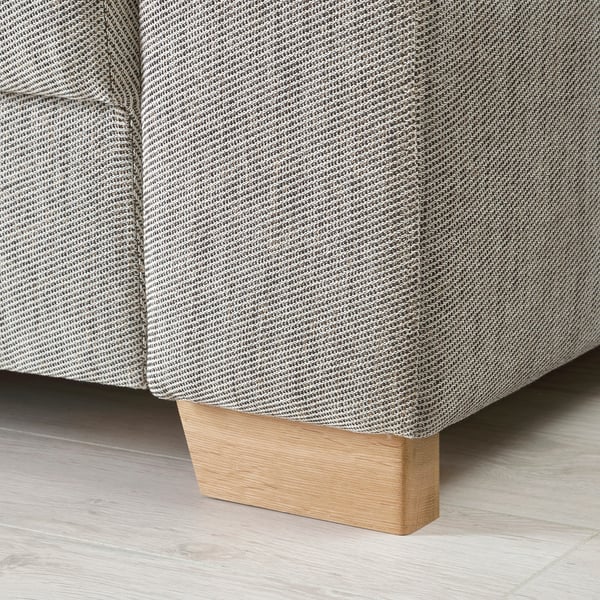 Moderne Sofaecke mit schlankem Design und hellem Holzbein; Hochwertiger Stoff und robuste Verarbeitung.
