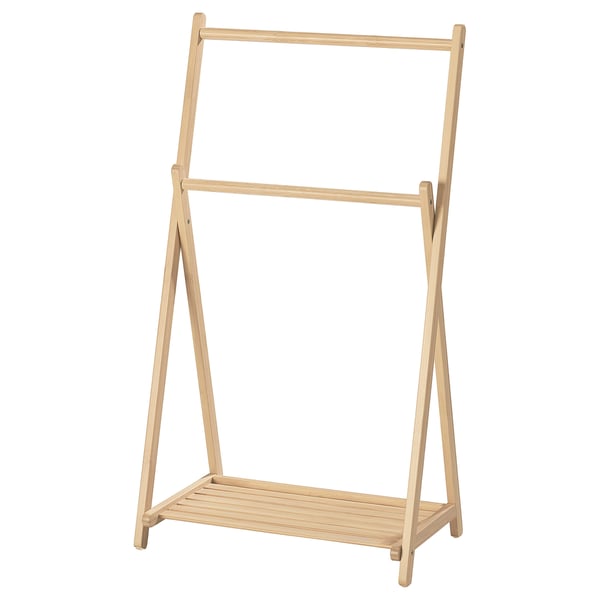 Ein STEGESUND, ein leichter Holzgarderobe mit Regal. Es ist naturbeige, rechteckig und einfach zum Aufhängen von Kleidung konzipiert.