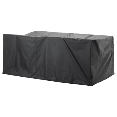 Eine schwarze TOSTERÖ Outdoor-Möbelabdeckung, rechteckig, wasserdicht, aus Polyester, zum Schutz einer Gartengarnitur mit 8 Sitzplätzen.