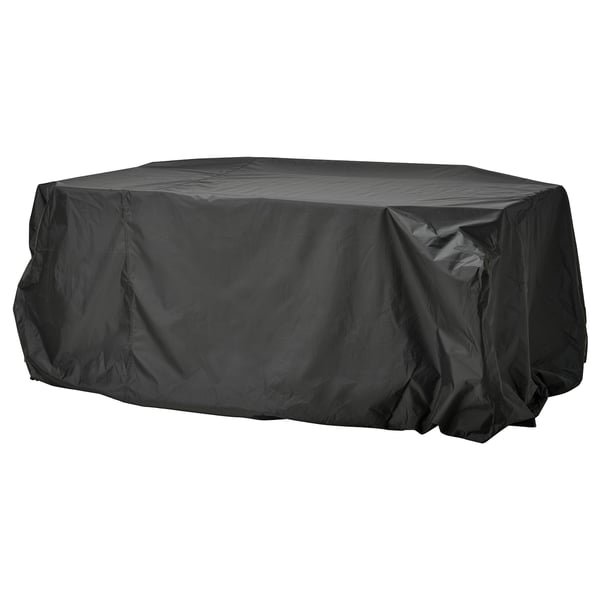 Eine schwarze Abdeckung für Gartenmöbel von TOSTERÖ. Es ist wasserdicht, rechteckig und aus Polyester mit Polyurethan-Beschichtung zum Schutz.