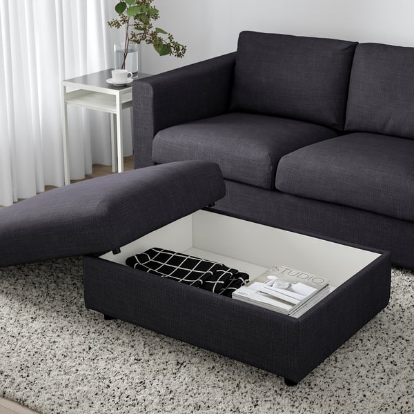 Modernes graues Sofa mit Lift-Top-Ottomane, verstecktem Stauraum und Magazin.
