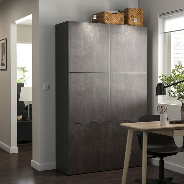 Modern room with BESTÅ grey cabinet, wooden table, black chair, and window.