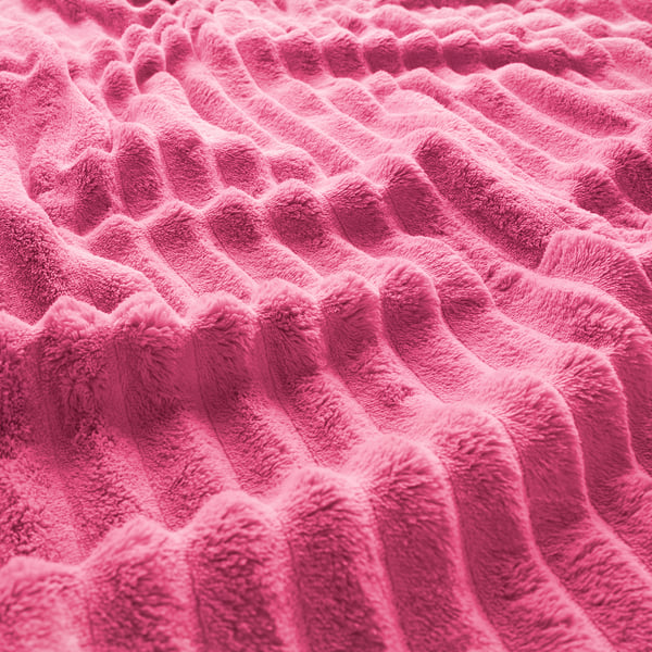 Bright pink soft fleece bedspread, close-up showing plush texture and warm, cosy material.