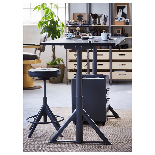 IDÅSEN adjustable desk black, swivel chair, sturdy base, cable net, round padded seat.