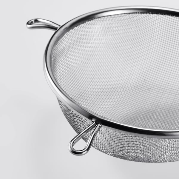 Round stainless steel strainer with two sturdy handles; fine mesh, high quality.