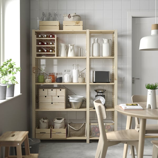 IVAR shelves with items near window and table