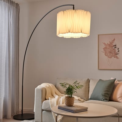 KUNGSHULT floor lamp with large arch, cream shade, saves space, soft light, cosy room.