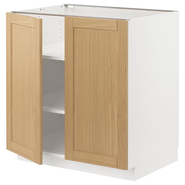 METOD kitchen cabinet with oak doors and white base.