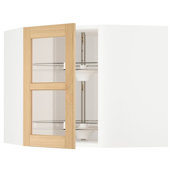 METOD kitchen cabinet with light oak wood doors, three glass shelves, and adjustable interior carousel.