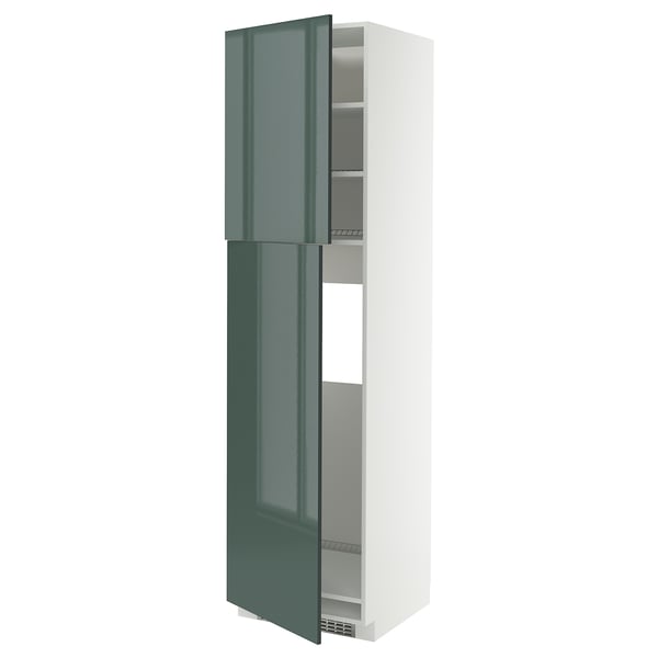 A white METOD kitchen cabinet with grey-green high-gloss doors. It stands tall with an adjustable shelf inside and a modern design.