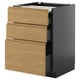 An ikea METOD kitchen cabinet with oak effect voxtorp drawers and dark gray frame, featuring three drawers.