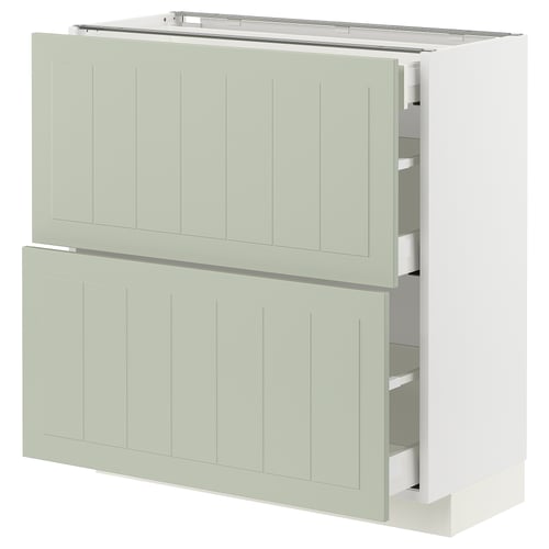 A light green METOD kitchen cabinet with smooth, crafted panels and multiple drawers. It has a modern, elegant design.