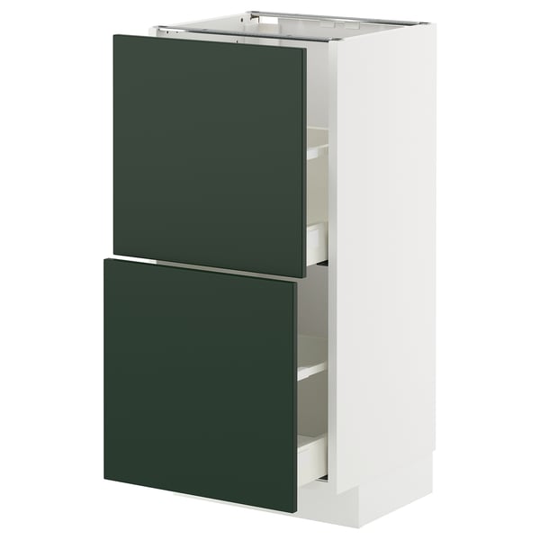 A white METOD kitchen cabinet with green havstorp drawer fronts. This modern design includes multiple drawers for storage.