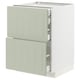 Modern kitchen cabinet in light green with open drawers.