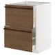 White METOD kitchen cabinet with dark brown drawers and wooden handles.