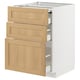 Modern kitchen cabinet, light wood drawers, white frame, sleek design.