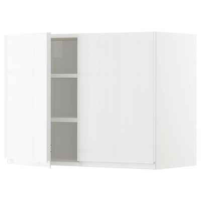A white METOD kitchen cabinet with a glossy finish and silver handles. It stands alone with a sleek, rectangular design.