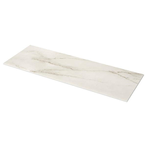 The MÖCKLARP is a white, sleek marble-look porcelain worktop, rectangular in shape. Its smooth, non-porous surface offers heat and scratch resistance.