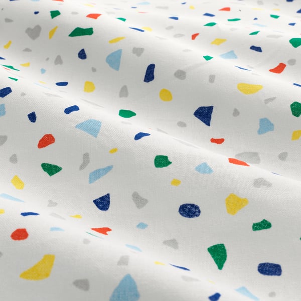 Close-up of white duvet with colourful terrazzo squares; high-quality, woven cotton.