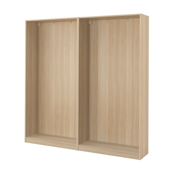 A light-colored wooden PAX wardrobe frame. It has a rectangular shape and a minimalist design, ideal for organising clothes in bedrooms.