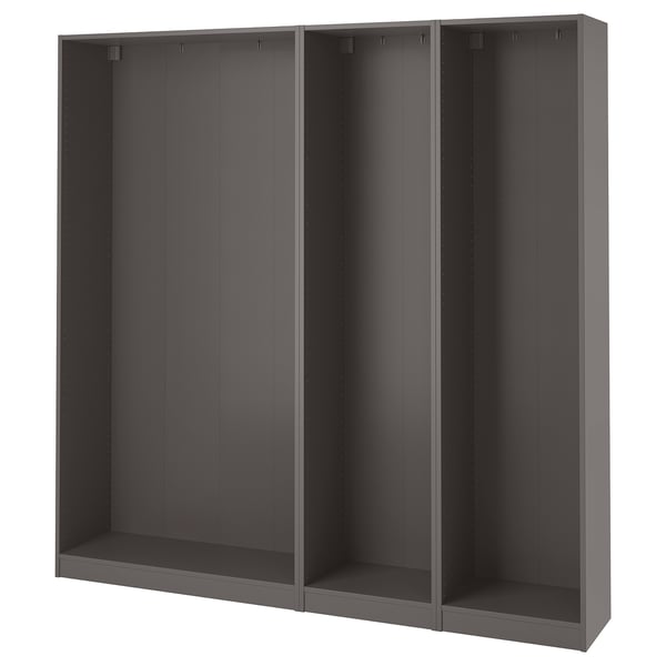 An empty, dark grey, modular wardrobe frame, named PAX, with three sections, designed for efficient storage.