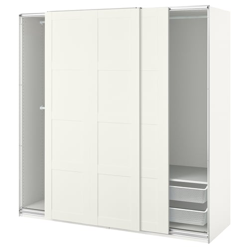 An off-white PAX wardrobe with sliding doors and two visible shelves.